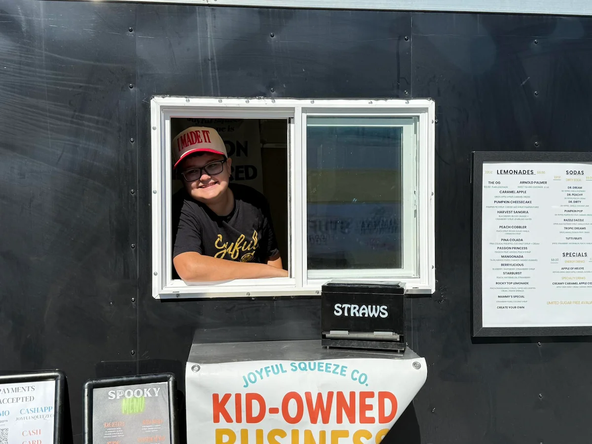 Blayne with the Joyful Squeeze Co. trailer