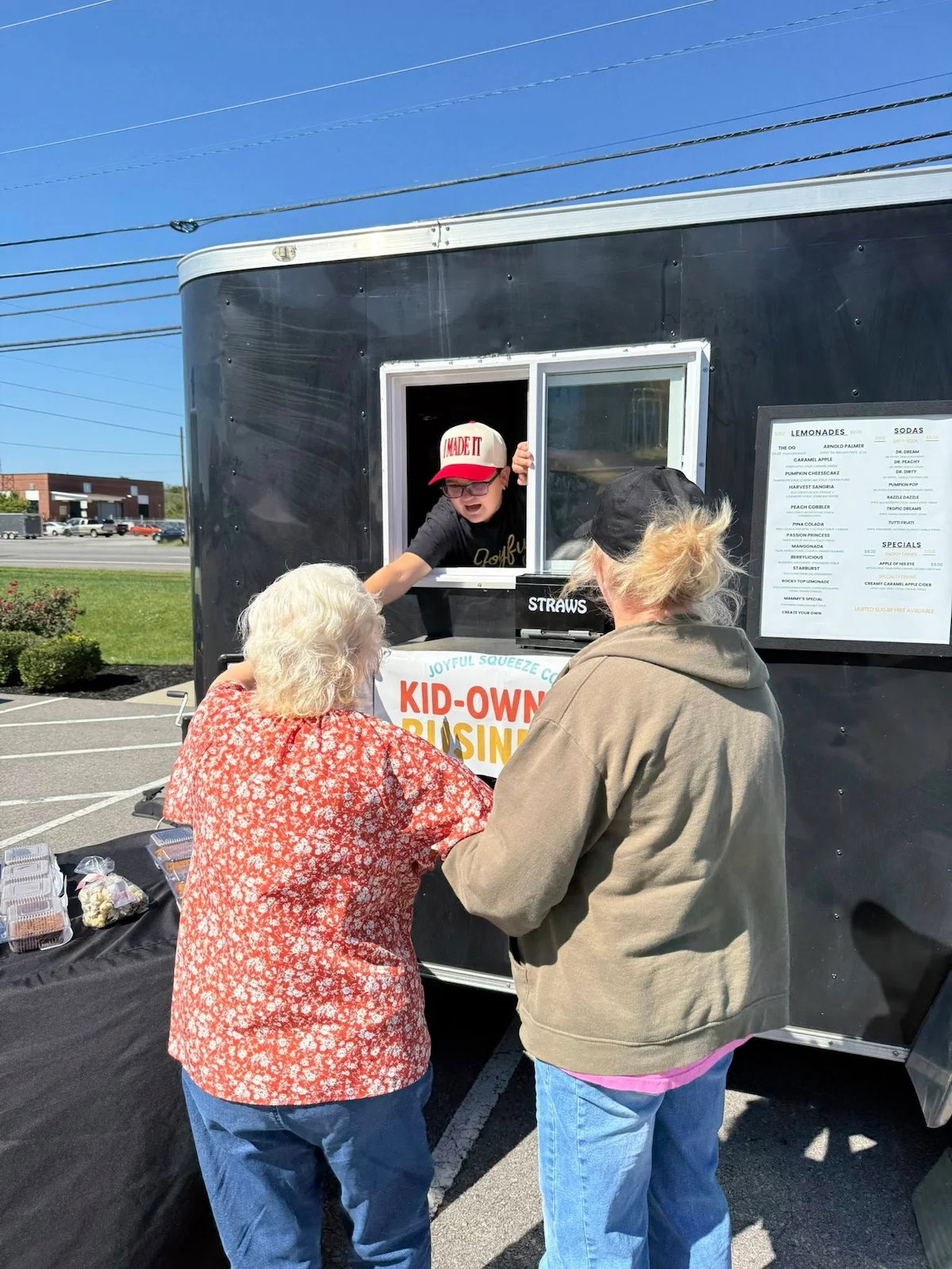 Blayne serving Joyful Squeeze Co. customers